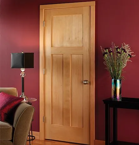 Picture of A meticulously crafted wooden door stands against a deep maroon wall, showcasing Quality Windows & Doors, Inc.’s commitment to quality outcomes. The subtle elegance hints at a larger story of skilled craftsmanship. Copyright ©2025 Diamond Certified Resource. - Quality Windows & Doors, Inc.