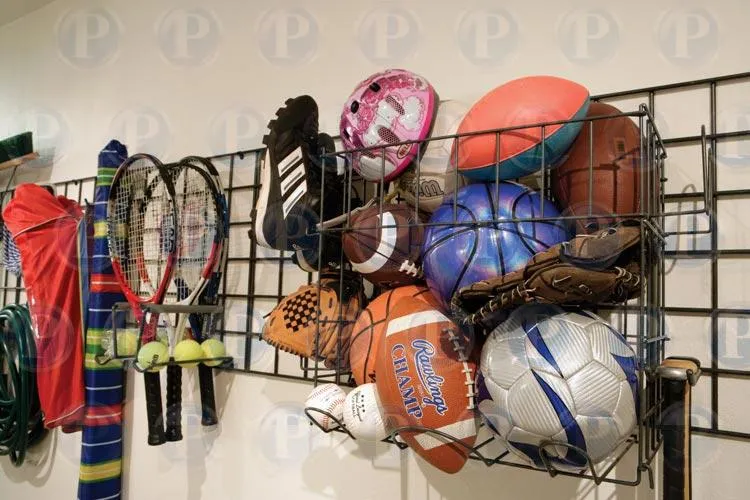 Picture of A neatly organized sports equipment rack displays tennis rackets, balls, and a variety of gear, illustrating PremierGarage's commitment to quality outcomes. Their expertise in creating efficient storage solutions is renowned. Copyright ©2025 Diamond Certified Resource

 - PremierGarage