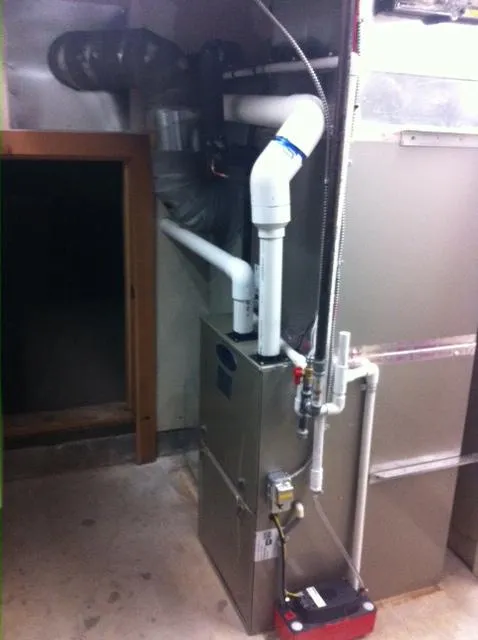 Picture of In a neat, dimly lit utility space, Degree HVAC, Inc. showcases its commitment to quality outcomes with a precisely installed furnace system. Recognized for expertise and quality, they ensure seamless functionality. Copyright ©2025 Diamond Certified Resource

 - Degree HVAC, Inc.
