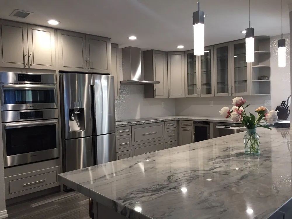 Picture of The gleaming marble countertops and sleek stainless steel appliances form a harmonious blend in this modern kitchen, exemplifying Today's Kitchen & Bath's focus on quality outcomes. Their commitment to impressive design is further underscored by earning Diamond Certified. Copyright ©2025 Diamond Certified Resource

 - Today's Kitchen & Bath