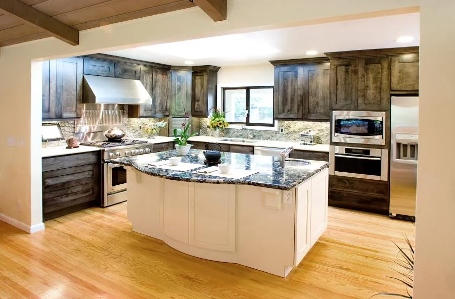 Picture of In a testament to Next Stage Design + Build's commitment to quality outcomes, this elegantly remodeled kitchen features rich wood cabinetry and modern appliances. Recognized for expertise and quality, the company brings harmony to every space. Copyright ©2025 Diamond Certified Resource

 - Next Stage Design + Build