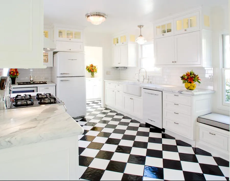 Picture of The monochrome elegance of this kitchen, featuring a classic black and white checkered floor, reflects Next Stage Design + Build's commitment to quality outcomes. Their attention to detail transforms spaces into timeless designs. Copyright ©2025 Diamond Certified Resource

 - Next Stage Design + Build