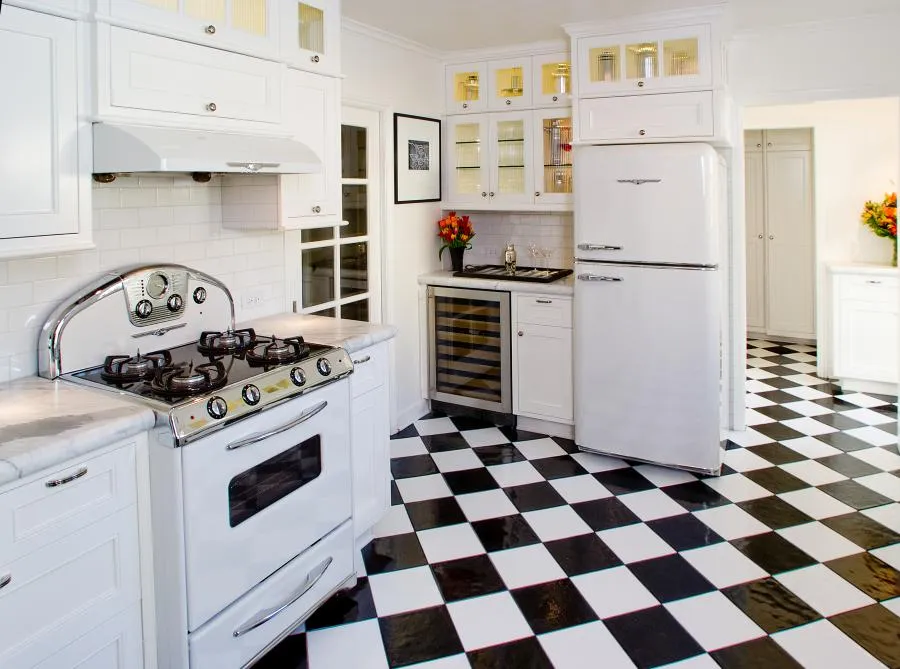 Picture of In this meticulously crafted kitchen, Next Stage Design + Build demonstrates its commitment to quality outcomes. The checkerboard tile floor and classic white cabinetry create a timeless aesthetic. The company focuses on quality outcomes, ensuring every detail enhances the space. Copyright ©2025 Diamond Certified Resource

 - Next Stage Design + Build