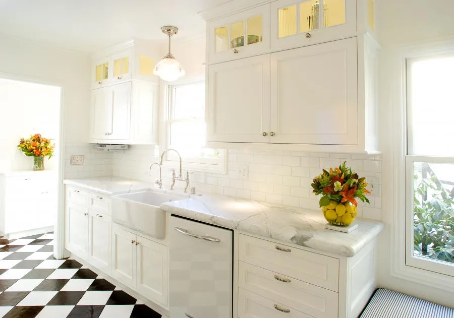 Picture of The bright elegance of this kitchen, with its checkerboard floor and seamless cabinetry, reflects Next Stage Design + Buildâ€™s commitment to high-quality outcomes. The thoughtful design hints at a space where every detail is meticulously crafted, embodying the companyâ€™s recognition for expertise and quality. Copyright ©2025 Diamond Certified Resource

 - Next Stage Design + Build