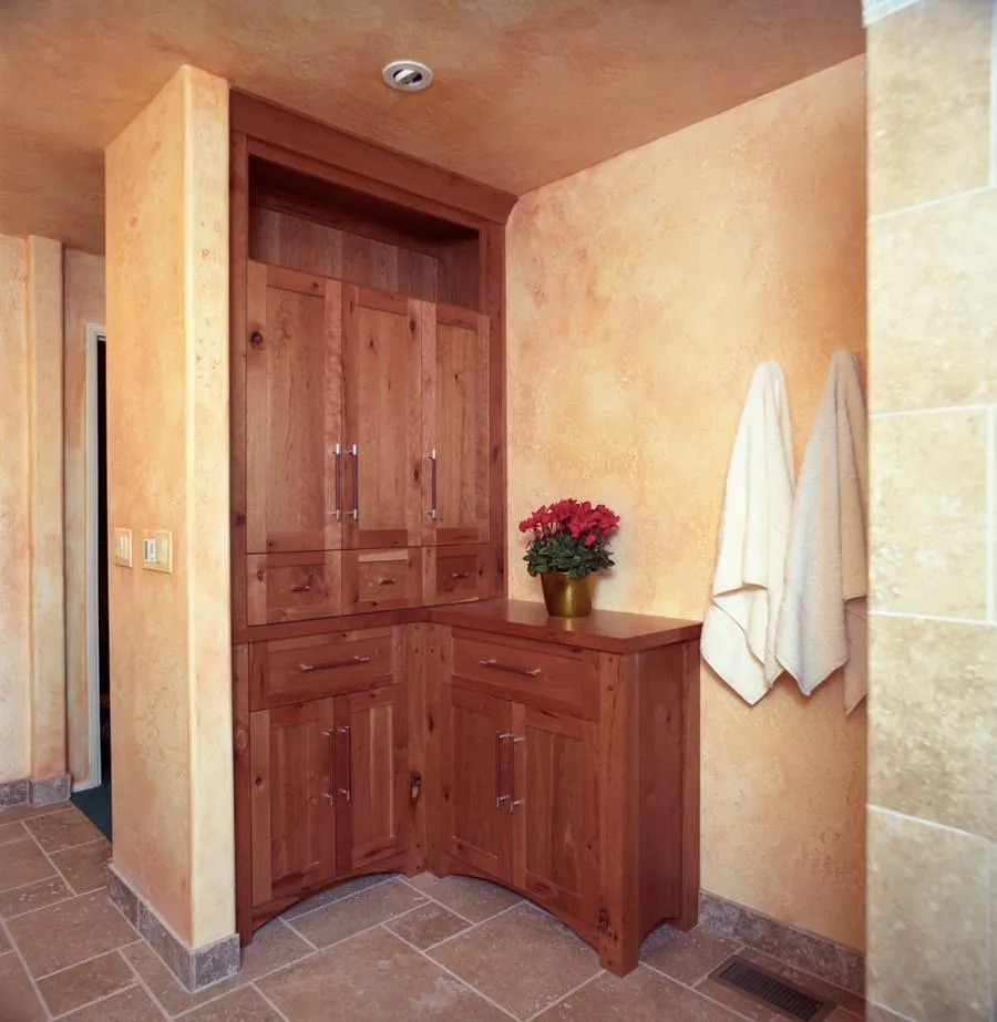 Picture of In a serene nook, rich wood cabinetry complements warm textured walls, embodying Next Stage Design + Build's focus on quality outcomes. These thoughtful details speak to their top-rated expertise. Copyright ©2025 Diamond Certified Resource

 - Next Stage Design + Build