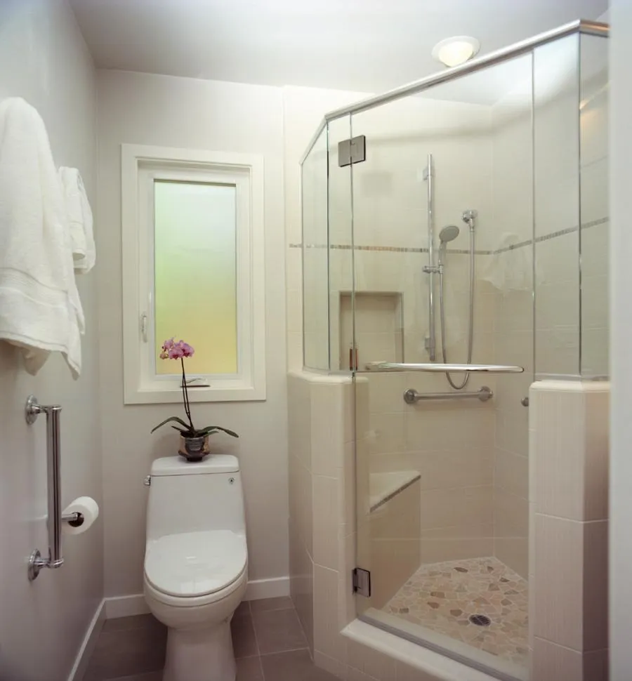 Picture of In a thoughtfully designed compact bathroom, Next Stage Design + Build highlights its focus on quality outcomes with a sleek glass shower and elegant orchid adding a touch of nature. The company is recognized for expertise and quality. Copyright ©2025 Diamond Certified Resource

 - Next Stage Design + Build