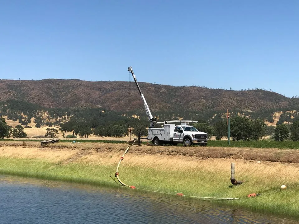 Picture of Amidst the serene landscape, a McLean & Williams, Inc. truck is stationed, poised for action with a raised boom, a testament to their recognized expertise and quality. Copyright ©2025 Diamond Certified Resource

 - McLean & Williams, Inc.