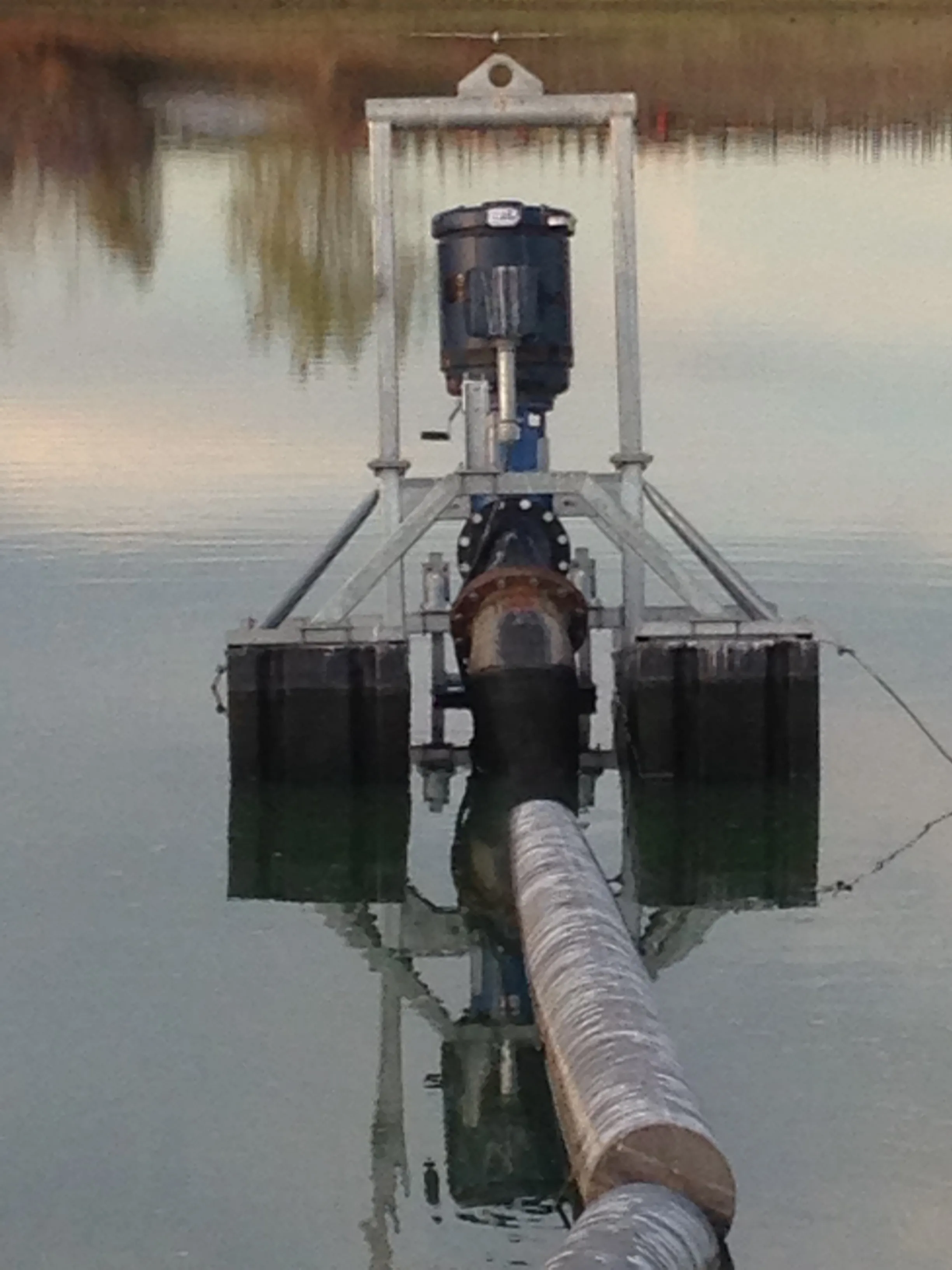 Picture of A solitary water pump stands at the heart of a tranquil lake, embodying McLean & Williams, Inc.'s dedication to quality outcomes in environmental management. The company's commitment to excellence consistently earns them high customer satisfaction ratings. Copyright ©2025 Diamond Certified Resource

 - McLean & Williams, Inc.