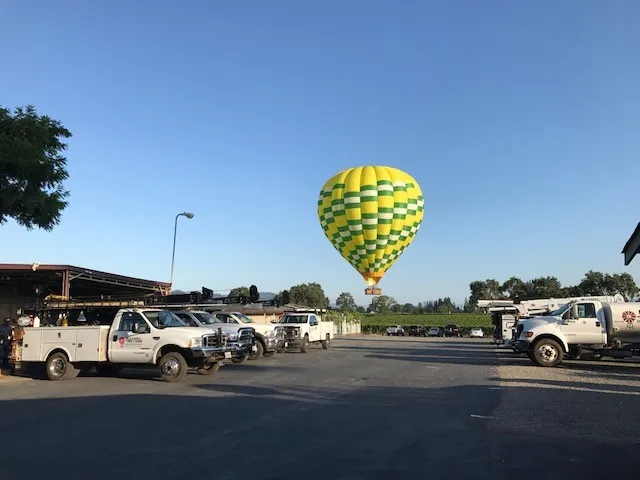 Picture of A vibrant hot air balloon drifts above the McLean & Williams, Inc. lot, a testament to their aspirations reaching new heights. Recognized for expertise and quality, the company continues to soar. Copyright ©2025 Diamond Certified Resource - McLean & Williams, Inc.