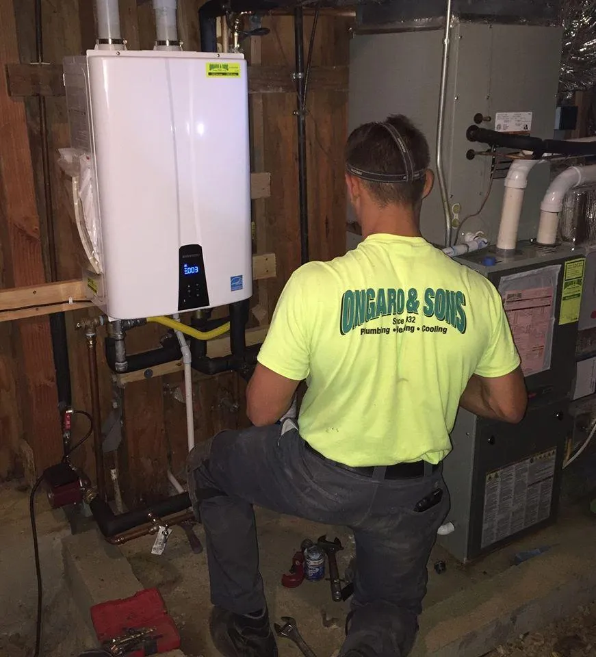 Picture of In a quiet basement, an Ongaro & Sons technician meticulously installs a tankless water heater, embodying the company's commitment to quality outcomes. Recognized for expertise and quality, Ongaro & Sons ensures efficiency with each project. Copyright ©2025 Diamond Certified Resource

 - Ongaro & Sons