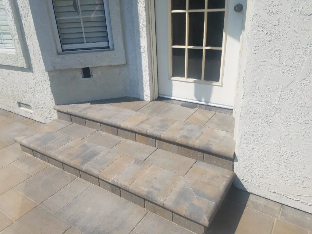 Picture of A meticulously crafted stone entryway showcases The Legacy Paver Group's commitment to quality outcomes, reflecting their top-rated expertise in every detail. Copyright ©2025 Diamond Certified Resource

 - The Legacy Paver Group