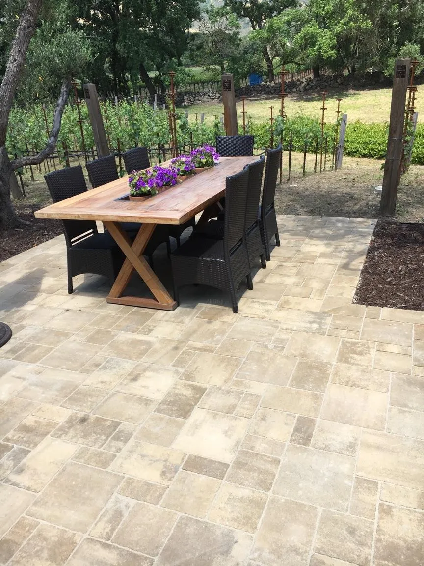 Picture of A beautifully crafted stone patio, surrounded by lush greenery, sets the stage for elegant outdoor gatherings. Designed by The Legacy Paver Group, renowned for high customer satisfaction ratings. Copyright ©2025 Diamond Certified Resource

 - The Legacy Paver Group