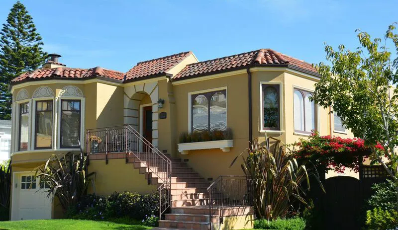 Picture of A charming home with Spanish-style architecture showcases Wedge Roofingâ€™s commitment to achieving the highest in quality. The meticulous roof work complements the vibrant garden below. Copyright ©2025 Diamond Certified Resource

 - Wedge Roofing