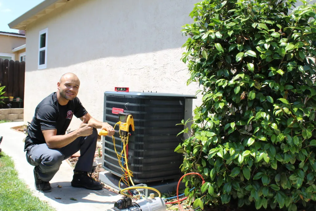 Picture of Lead Install Technician Gilbert Caceres installs a new HVAC system in Antioch. - Perfect Star Heating, Cooling, & Electrical