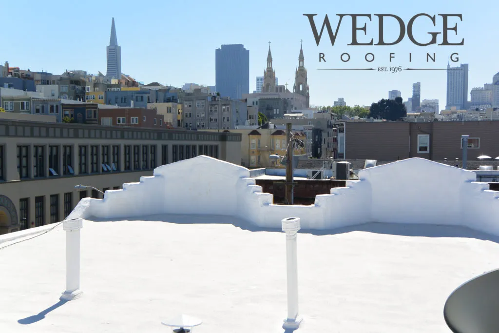 Picture of Wedge Roofing's expertise in flat roof installation is evident on this pristine, whitewashed rooftop against the backdrop of a bustling cityscape. The company has high customer satisfaction ratings for quality outcomes. Copyright ©2025 Diamond Certified Resource

 - Wedge Roofing