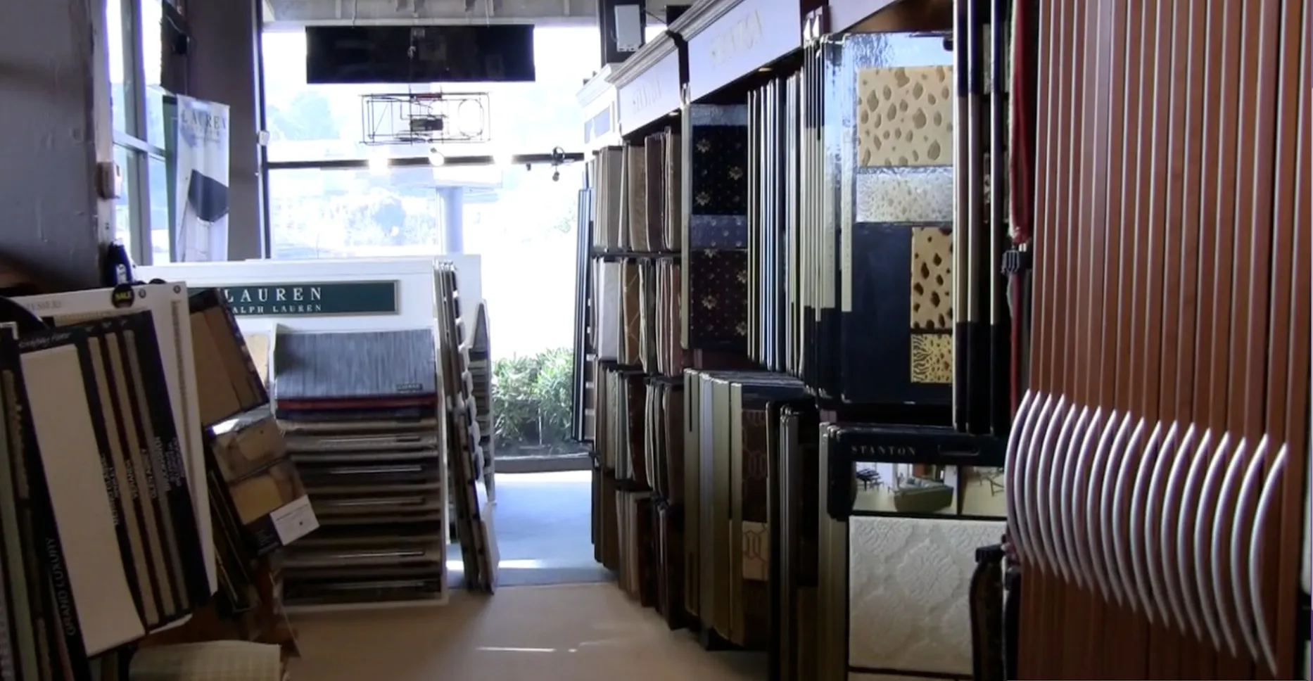 Picture of Sunlight filters through the showroom, casting a warm glow on a diverse selection of carpets neatly displayed. At City Carpets, each piece reflects a commitment to quality outcomes, earning them Diamond Certified status. Copyright ©2025 Diamond Certified Resource - City Carpets