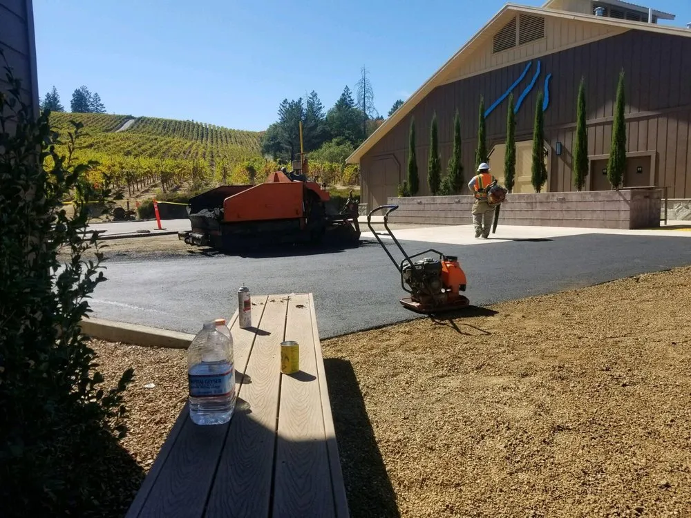 Picture of  Amidst a serene vineyard backdrop, Jackson's Paving & Equipment Rentals, Inc. crafts a flawless paved surface, exemplifying their dedication to quality outcomes. With a focus on precision and expertise, the company consistently achieves the highest ratings for quality. Copyright ©2025 Diamond Certified Resource.

 - Jackson's Paving & Equipment Rentals, Inc.