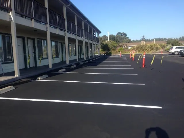 Picture of Freshly paved and marked, an empty parking lot stands ready for visitors. Jackson's Paving & Equipment Rentals, Inc. showcases their focus on quality outcomes with precise craftsmanship. Copyright ©2025 Diamond Certified Resource. - Jackson's Paving & Equipment Rentals, Inc.