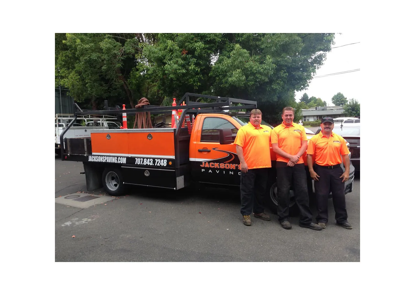 Picture of  Three team members of Jackson's Paving & Equipment Rentals, Inc. stand proudly beside their branded truck, highlighting their commitment to quality outcomes in every project. Consistently recognized for expertise and quality, the company maintains high customer satisfaction ratings. Copyright ©2025 Diamond Certified Resource.

 - Jackson's Paving & Equipment Rentals, Inc.