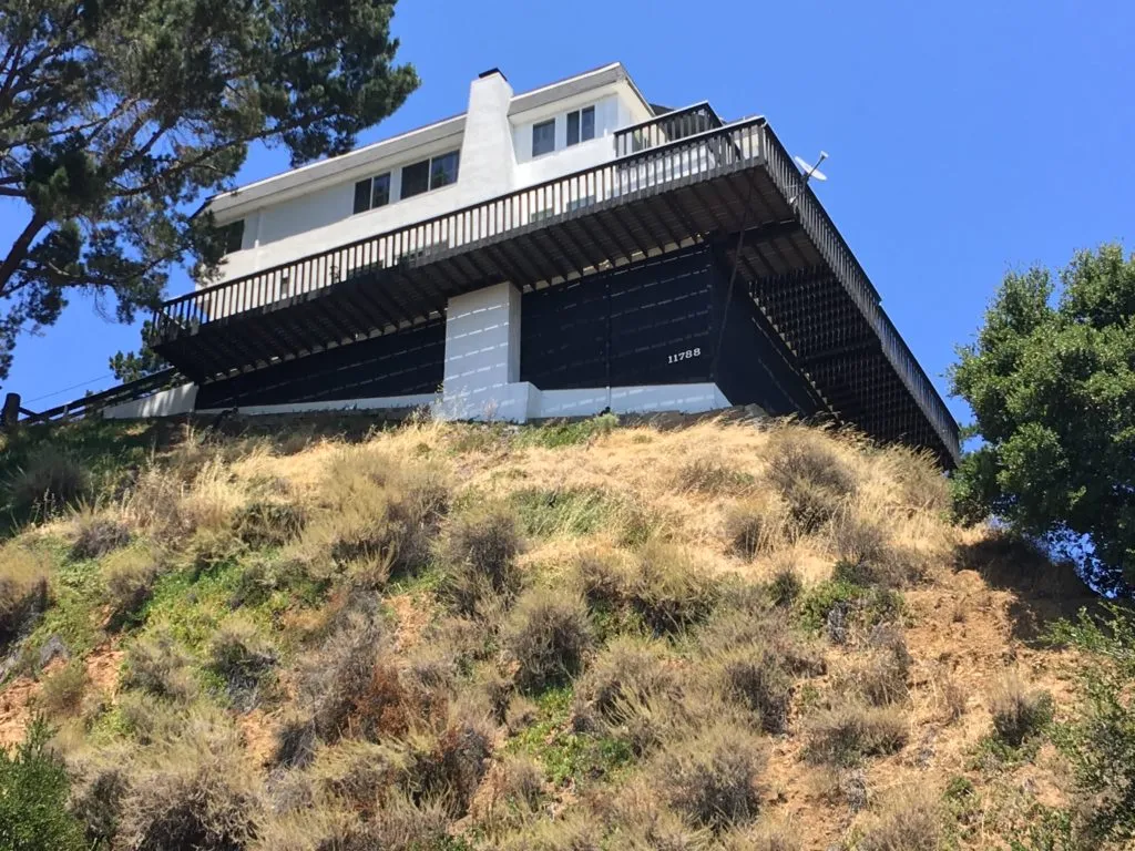 Picture of  Perched on a hillside, this home showcases S & S Painting and Coatings, Inc.'s commitment to quality outcomes. Their expertise is evident in the precise, protective coatings applied to the structure, blending functionality with aesthetics. Recognized for expertise and quality. Copyright ©2025 Diamond Certified Resource.

 - S & S Painting and Coatings, Inc.