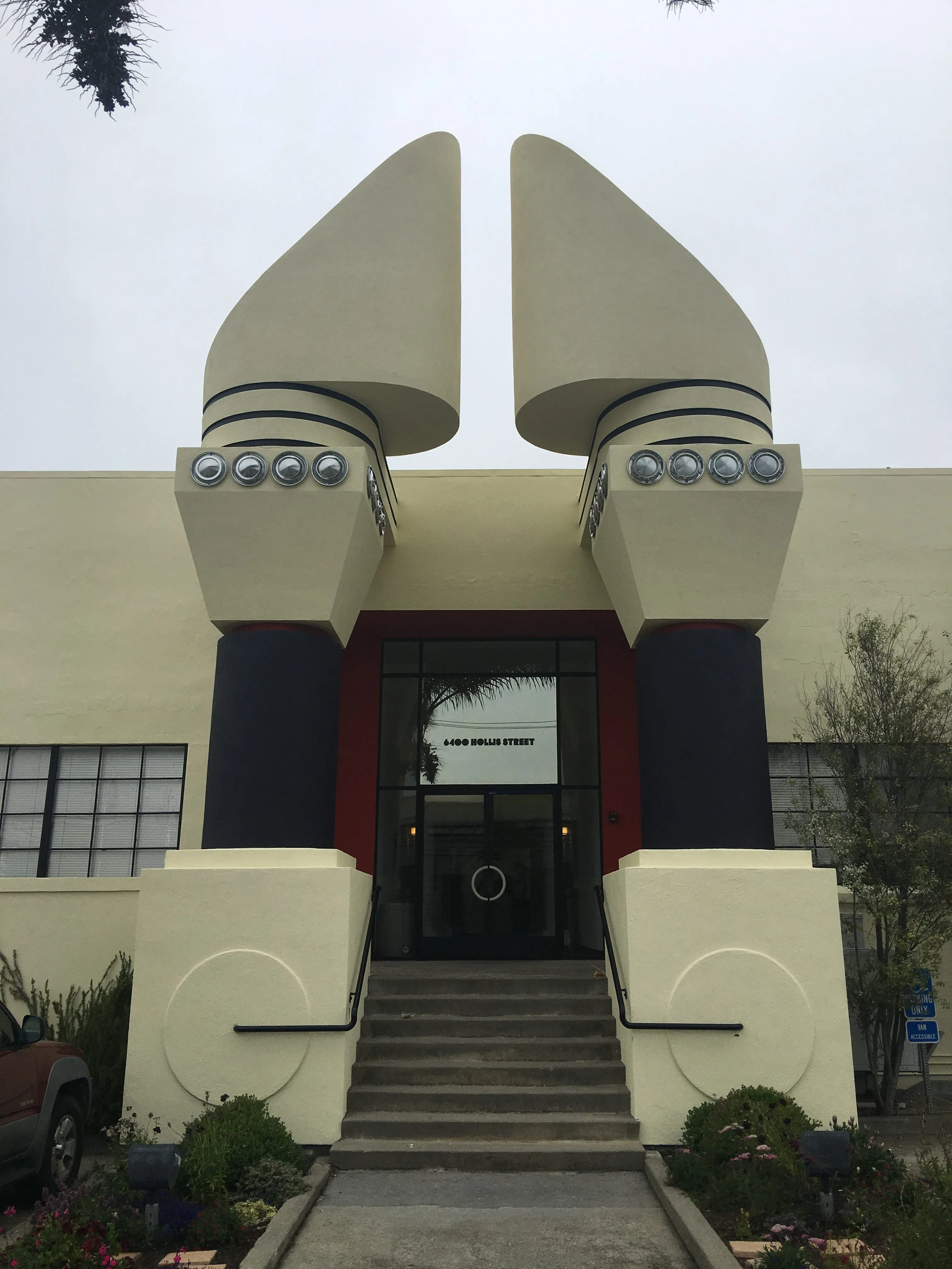 Picture of The unique architecture of this entrance, with its bold, circular columns and geometric lines, reflects the precision and quality that S & S Painting and Coatings, Inc. brings to every project. Recognized for expertise and quality, the company continues to transform spaces. Copyright ©2025 Diamond Certified Resource. - S & S Painting and Coatings, Inc.