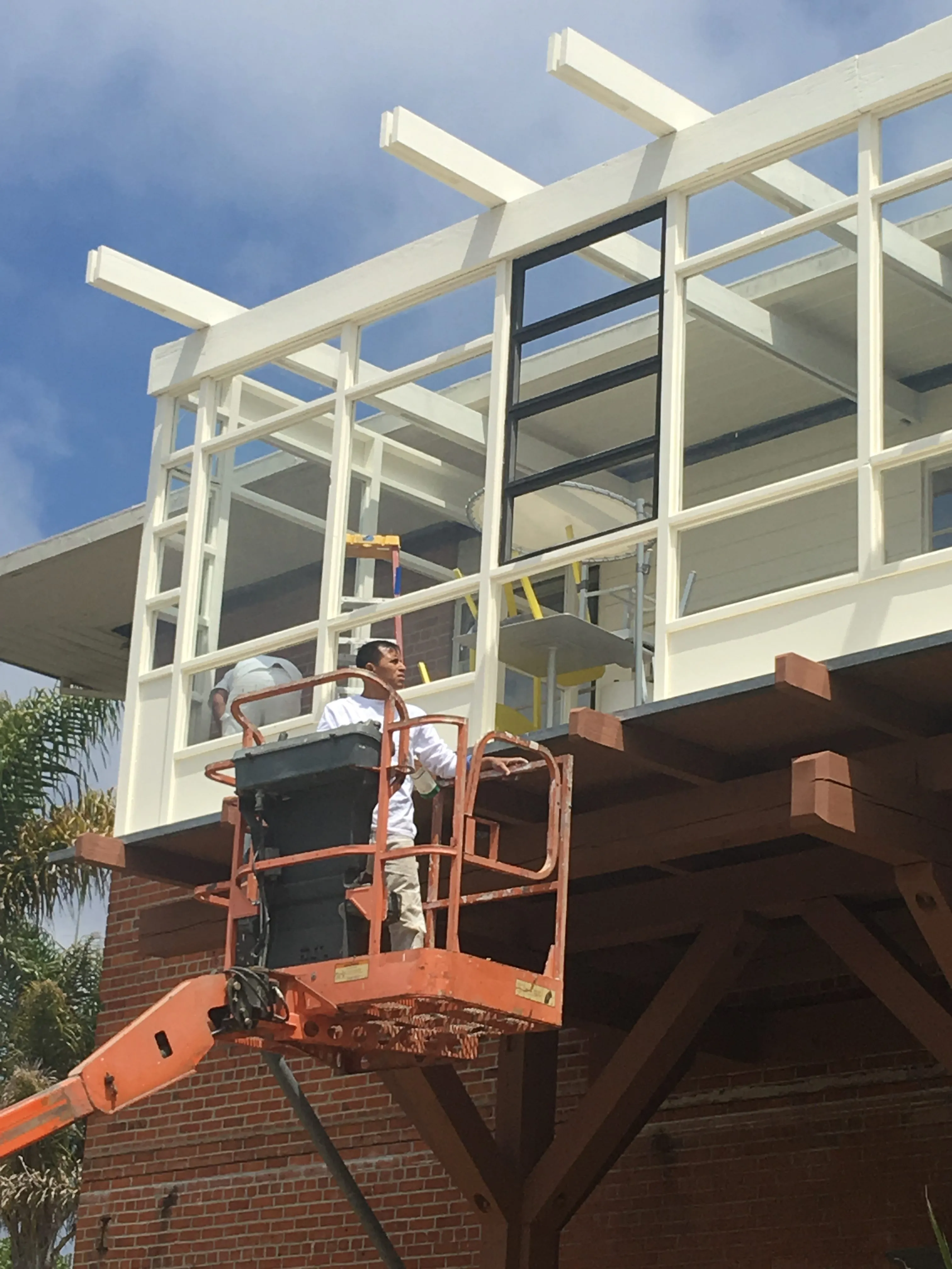 Picture of  A dedicated worker from S & S Painting and Coatings, Inc. expertly handles an elevated platform, applying finishing touches to a building's exterior, reflecting the company’s focus on quality outcomes. Copyright ©2025 Diamond Certified Resource.

 - S & S Painting and Coatings, Inc.