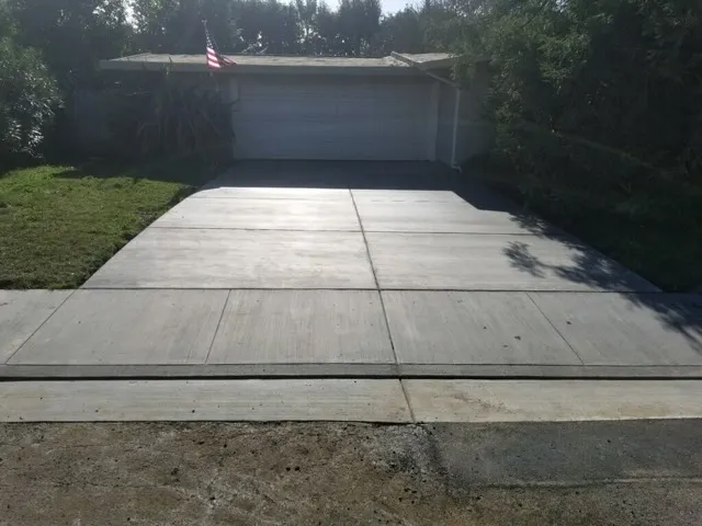 Picture of  A newly paved driveway gleams under the afternoon sun, showcasing the precision and quality of Jackson's Paving & Equipment Rentals, Inc. The company's dedication to quality outcomes is evident in every detail. Copyright ©2025 Diamond Certified Resource.

 - Jackson's Paving & Equipment Rentals, Inc.