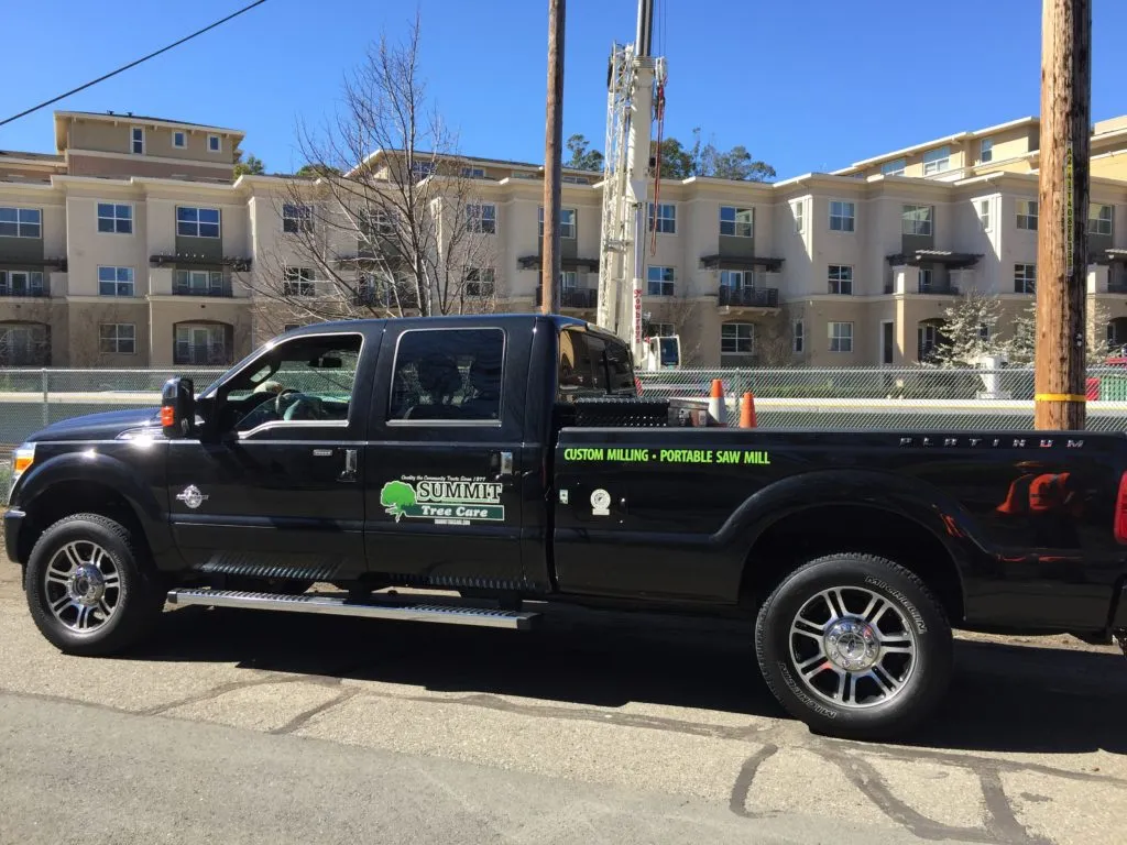 Picture of A Summit Tree Care truck, stationed beside a residential building, embodies the companyâ€™s commitment to quality outcomes with custom milling and portable sawmill services. Summit Tree Care consistently achieved a Highest in Quality rating. Copyright ©2025 Diamond Certified Resource

 - Summit Tree Care