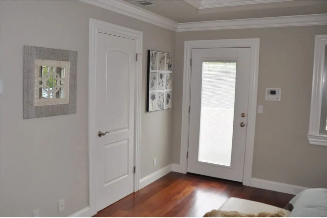 Picture of  In a sunlit corner, a pristine door with a frosted glass window complements the polished wooden floor, reflecting Stanford Painting, Inc.'s focus on quality outcomes. Their dedication to detail has consistently earned them top ratings for Quality. Copyright ©2025 Diamond Certified Resource.

 - Stanford Painting, Inc.