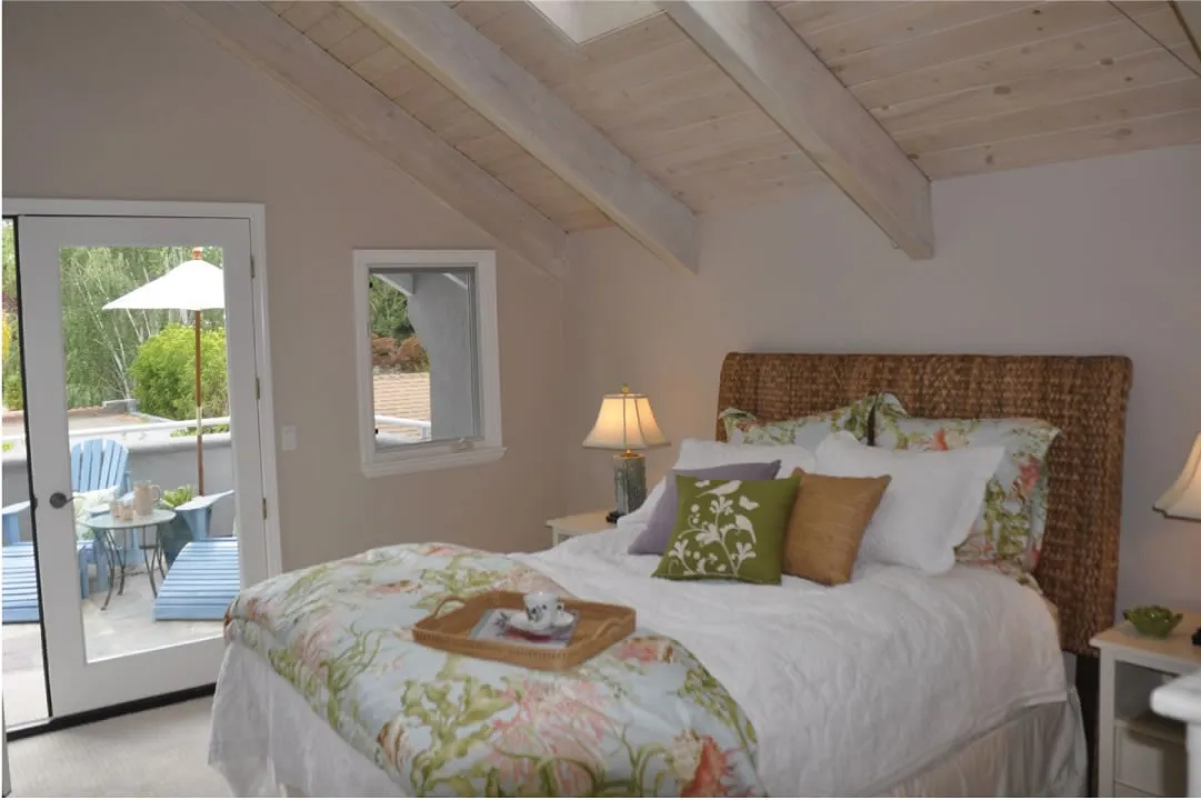 Picture of A serene bedroom with a view of a sunlit patio reflects the attention to detail for which Stanford Painting, Inc. is renowned. The company consistently achieved a Highest in Quality rating. Copyright ©2025 Diamond Certified Resource. - Stanford Painting, Inc.