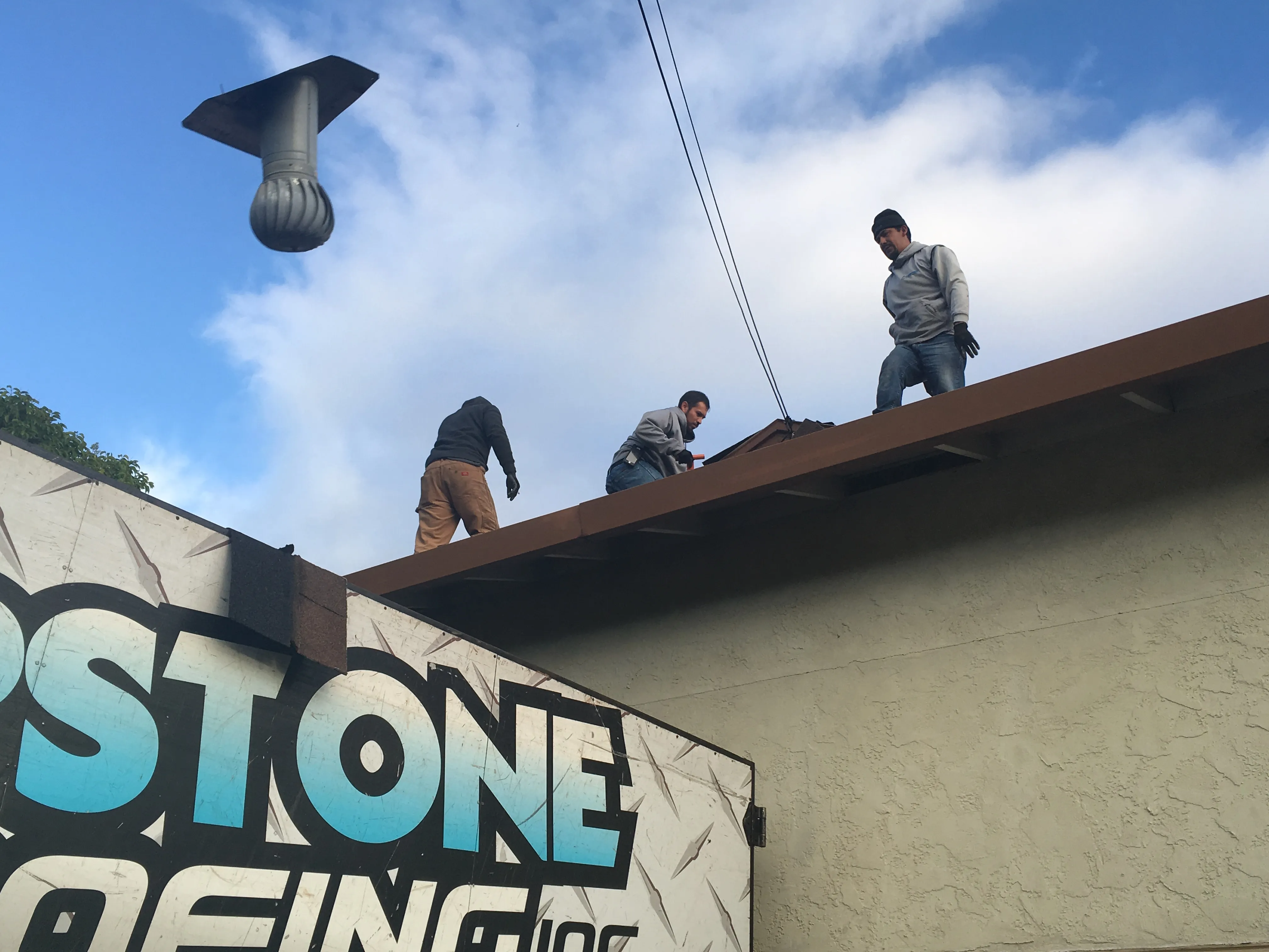 Picture of  On a clear day, workers from Capstone Roofing, Inc. diligently perform maintenance atop a roof, embodying the company's focus on quality outcomes. Their attention to detail ensures the integrity of every project. Copyright ©2025 Diamond Certified Resource.

 - Capstone Roofing, Inc.
