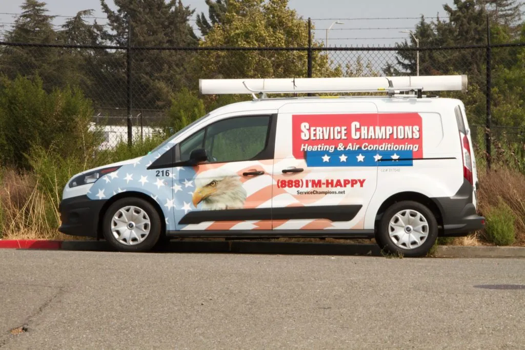 Service Champions van with an eagle design, parked outdoors, with logo and contact info visible. Service Champions van with an eagle design, parked outdoors, with logo and contact info visible.