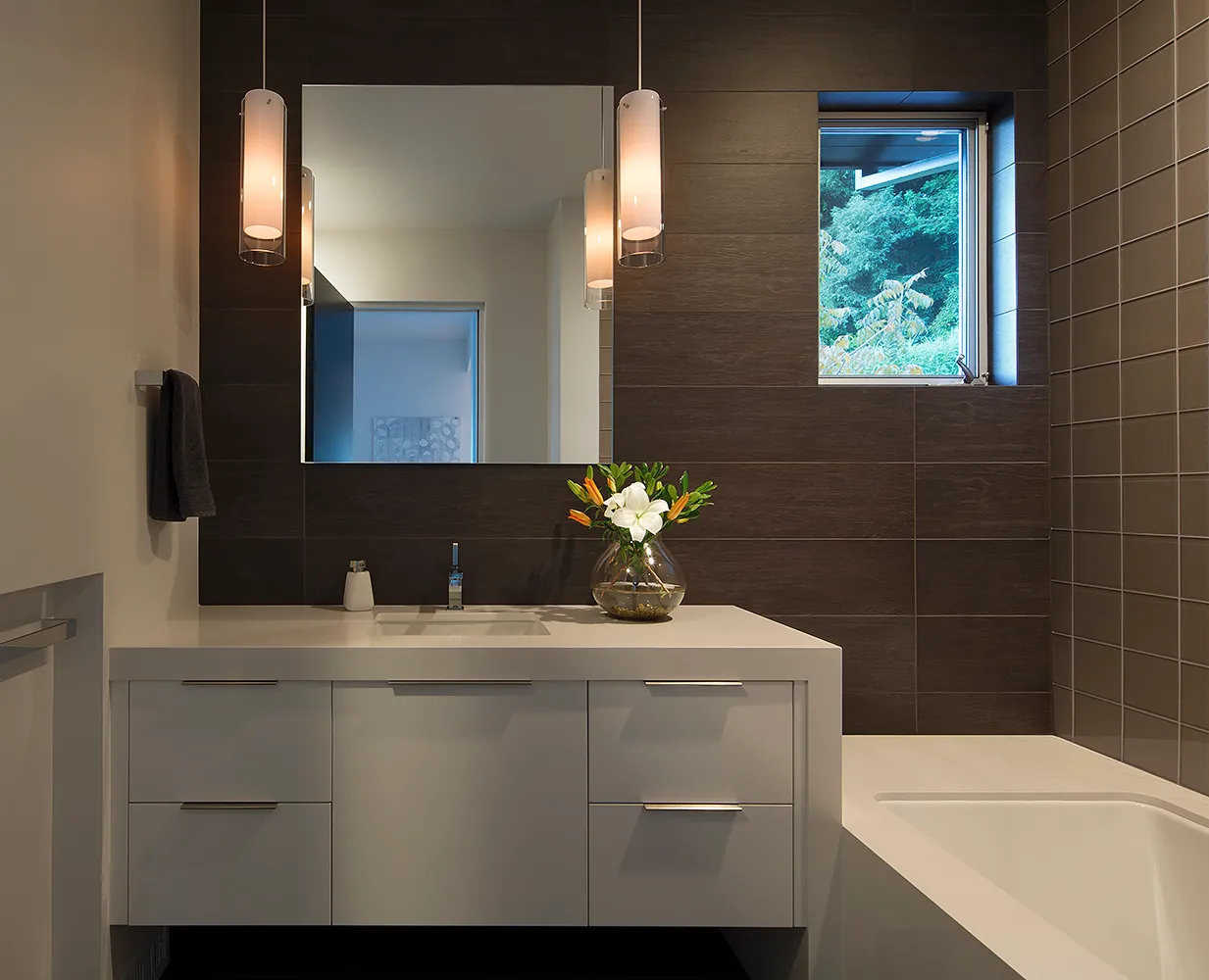 Picture of A sleek, modern bathroom showcases Diablo Valley Cabinetryâ€™s commitment to quality. The harmonious design features dark tiles, a minimalist vanity, and soft lighting. Recognized for expertise and quality, the company creates spaces where elegance meets functionality. Copyright ©2025 Diamond Certified Resource

 - Diablo Valley Cabinetry