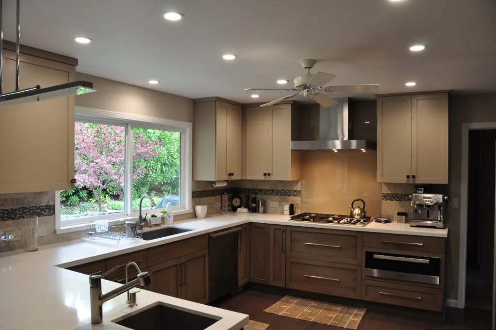 Picture of A beautifully remodeled kitchen by Diablo Valley Cabinetry showcases sleek, modern cabinetry and a stainless steel range, set against a lush garden view, reflecting the company's focus on quality outcomes. Copyright ©2025 Diamond Certified Resource - Diablo Valley Cabinetry