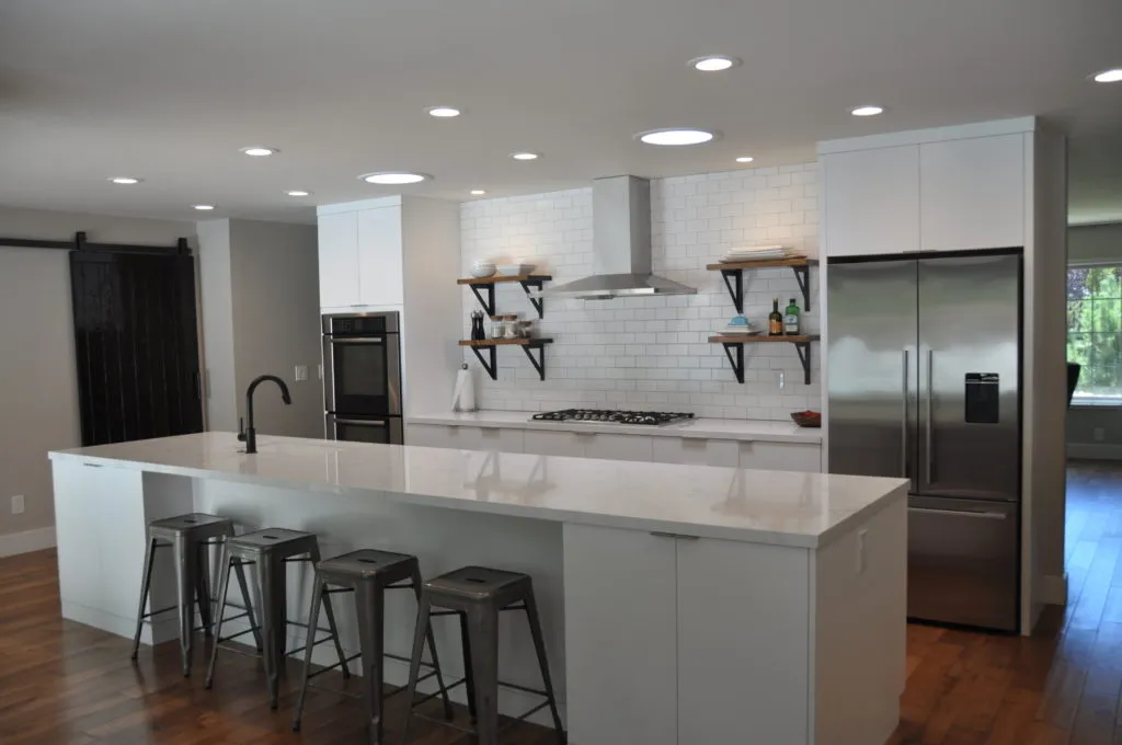 Picture of In this modern kitchen, Diablo Valley Cabinetry showcases its focus on quality outcomes with sleek white cabinetry and a spacious island, reflecting its high customer satisfaction ratings. Copyright ©2025 Diamond Certified Resource

 - Diablo Valley Cabinetry