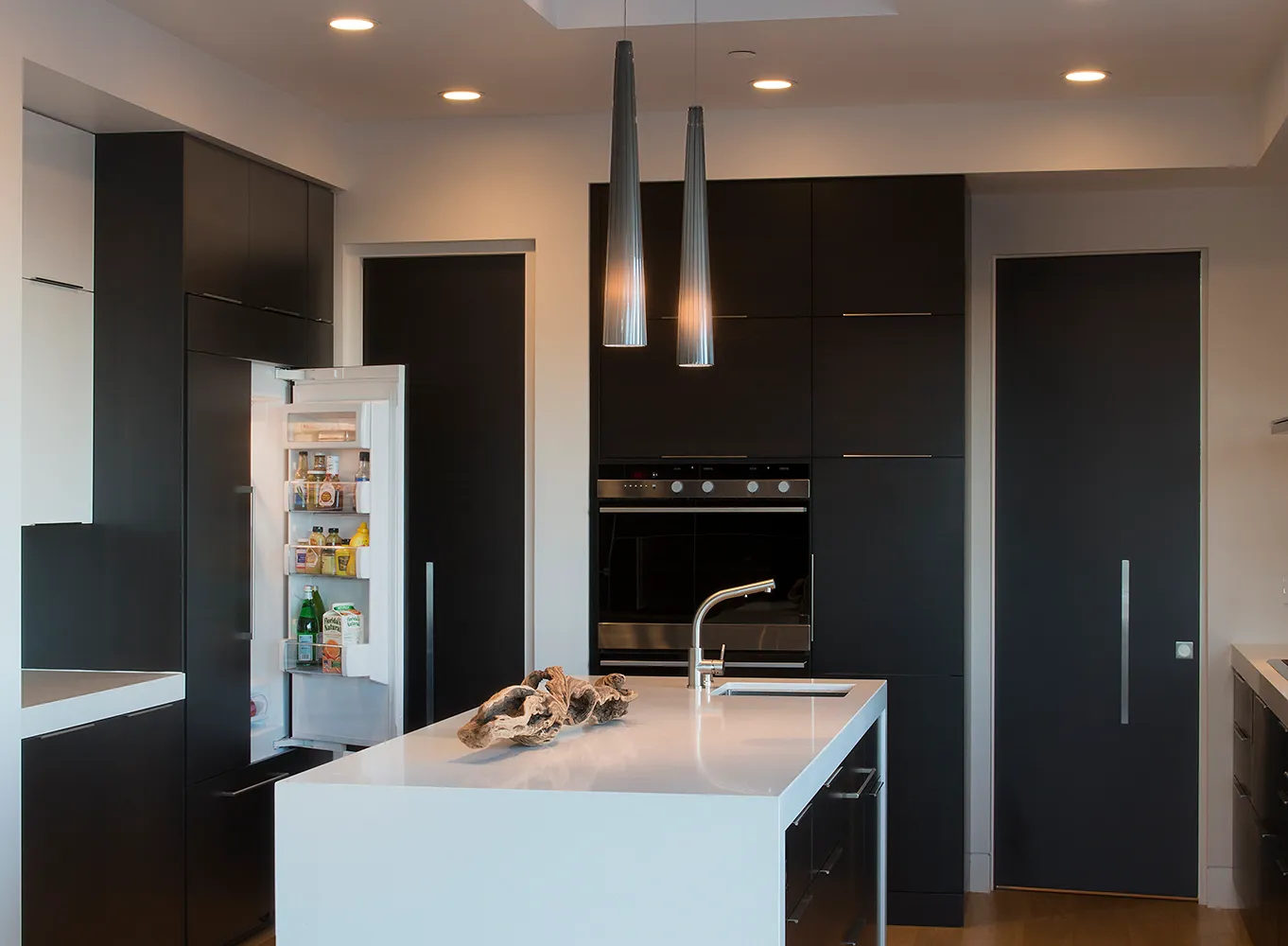 Picture of The seamless blend of contemporary design and functionality in this sleek kitchen highlights Diablo Valley Cabinetry's commitment to quality outcomes. The open fridge hints at everyday life captured in a refined space. Copyright ©2025 Diamond Certified Resource

 - Diablo Valley Cabinetry