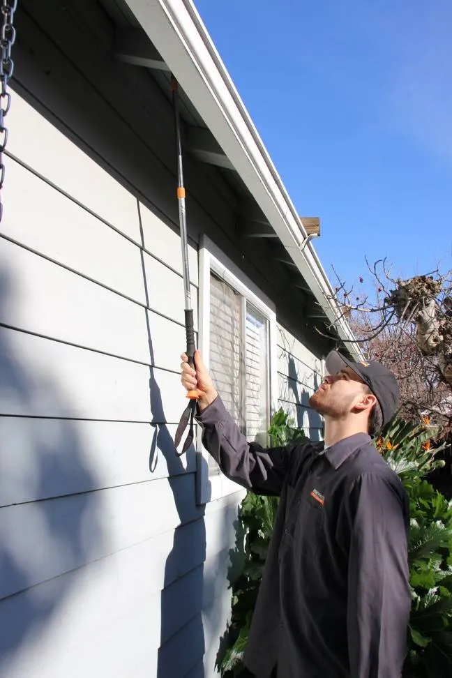 Picture of A Mightymite Termite Services professional meticulously inspects eaves for signs of termite activity. This dedication to detail underscores the companyâ€™s focus on quality outcomes. Copyright ©2025 Diamond Certified Resource

 - Mightymite Termite Services