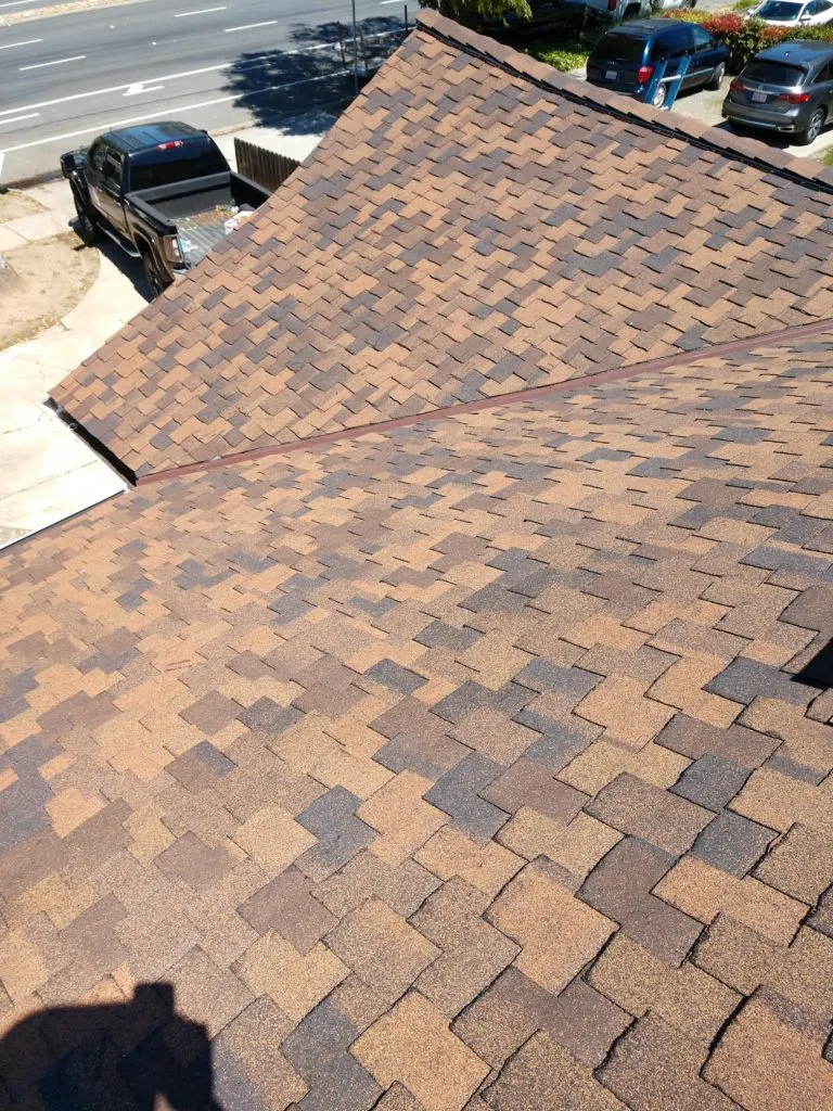 Picture of A meticulously installed shingle roof showcases Bay 101 Roofing, Inc.'s commitment to quality outcomes. The careful alignment of each shingle reflects their focus on precision and customer satisfaction. Copyright ©2025 Diamond Certified Resource. - Bay 101 Roofing, Inc.