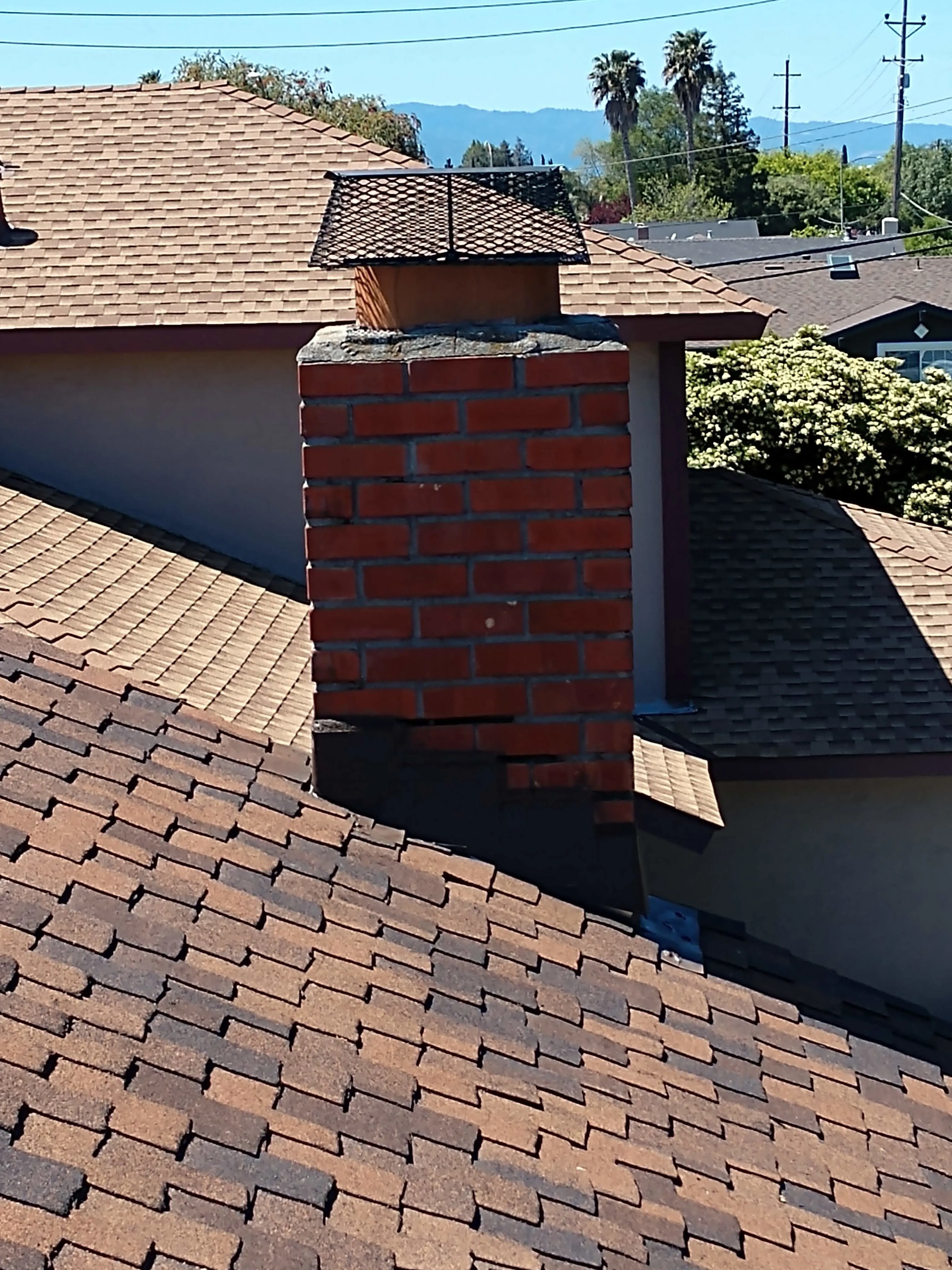Picture of  The detailed craftsmanship of a freshly installed chimney cap on a sturdy rooftop showcases Bay 101 Roofing, Inc.'s commitment to quality outcomes. Their expertise ensures durability and protection, enhancing the safety of residential homes. Copyright ©2025 Diamond Certified Resource.

 - Bay 101 Roofing, Inc.