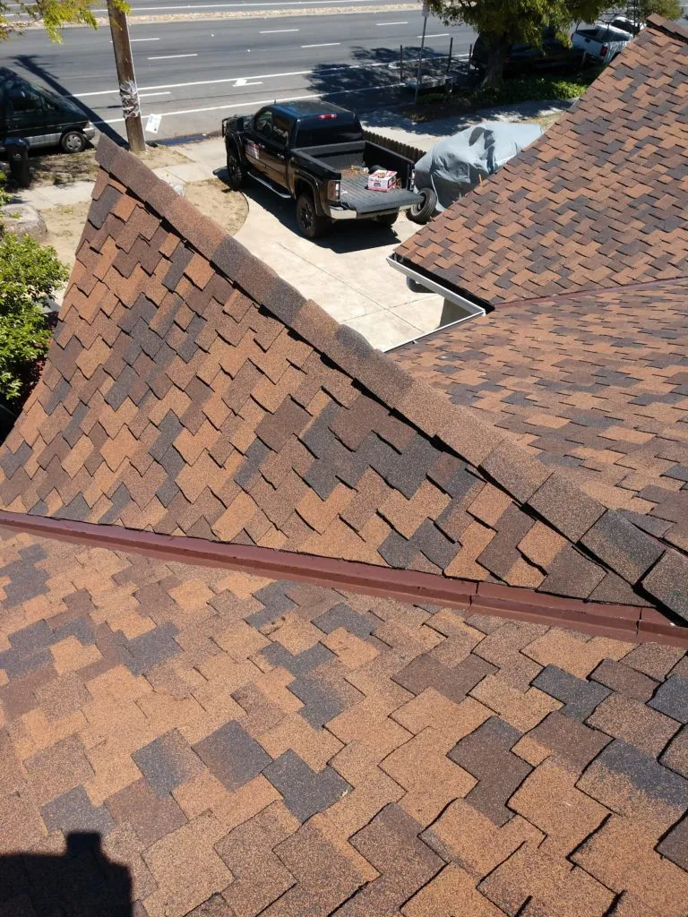 Picture of  A meticulously crafted roof showcases the precision and care of Bay 101 Roofing, Inc. The neat alignment of shingles reflects their focus on quality outcomes, underscoring their high customer satisfaction ratings. Copyright ©2025 Diamond Certified Resource.

 - Bay 101 Roofing, Inc.