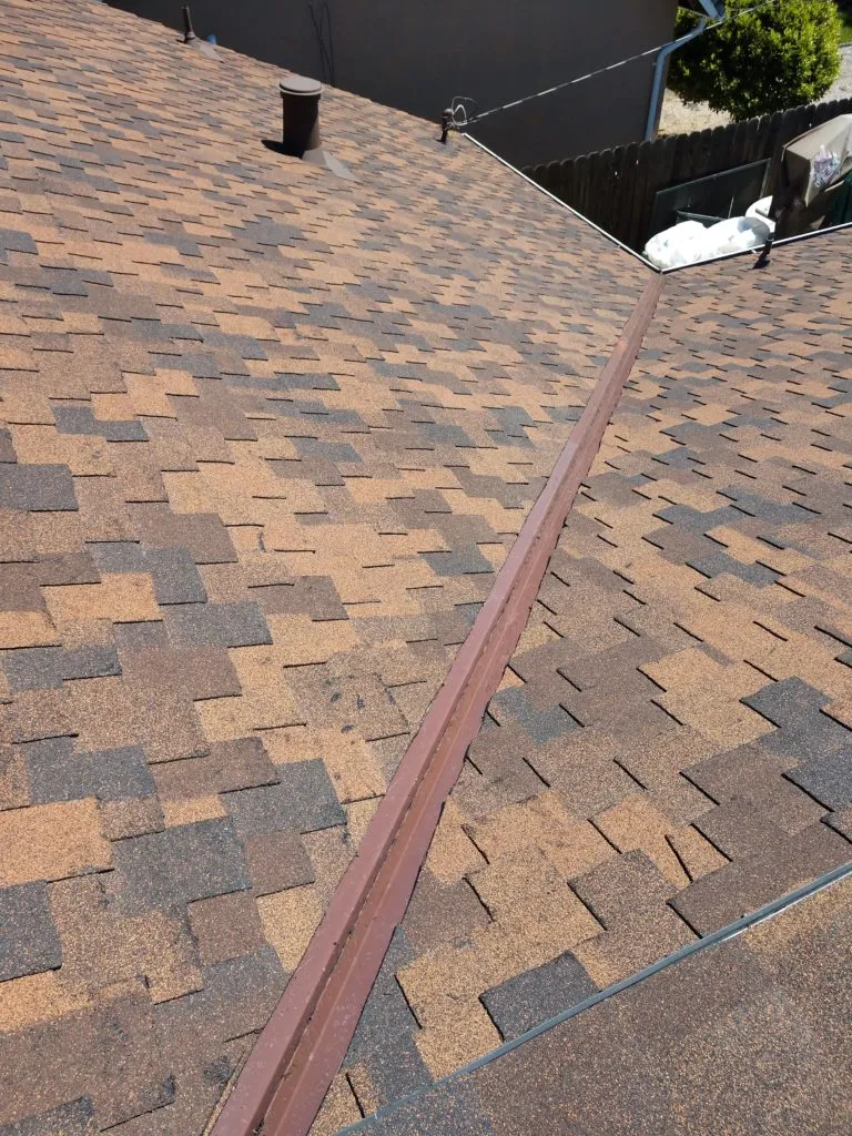 Picture of A meticulously aligned rooftop displays the craftsmanship of Bay 101 Roofing, Inc., focusing on quality outcomes as seen in the precise shingle arrangement. Copyright ©2025 Diamond Certified Resource. - Bay 101 Roofing, Inc.