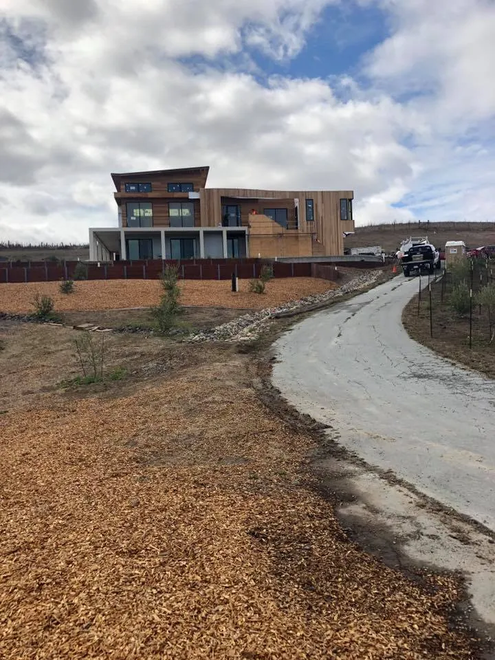 Picture of  A newly completed modern home stands proudly against a backdrop of open sky, showcasing Evenich Construction, Inc.'s commitment to quality outcomes. This project reflects their high customer satisfaction ratings. Copyright ©2025 Diamond Certified Resource.

 - Evenich Construction, Inc.