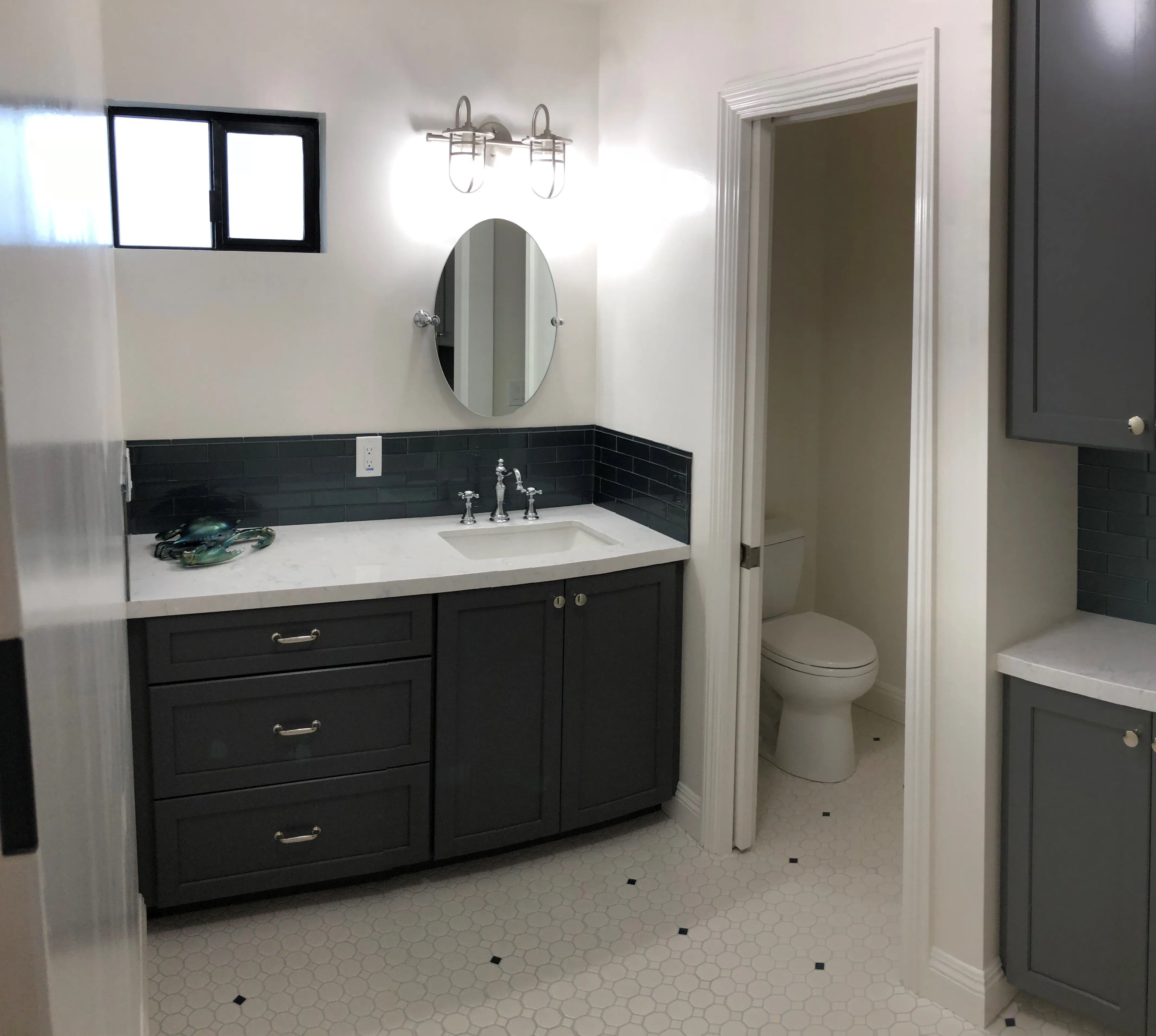 Picture of  A freshly remodeled bathroom by Evenich Construction, Inc. highlights the elegance of simplicity with its modern fixtures and sleek design, reflecting the company's focus on quality outcomes. Copyright ©2025 Diamond Certified Resource.

 - Evenich Construction, Inc.