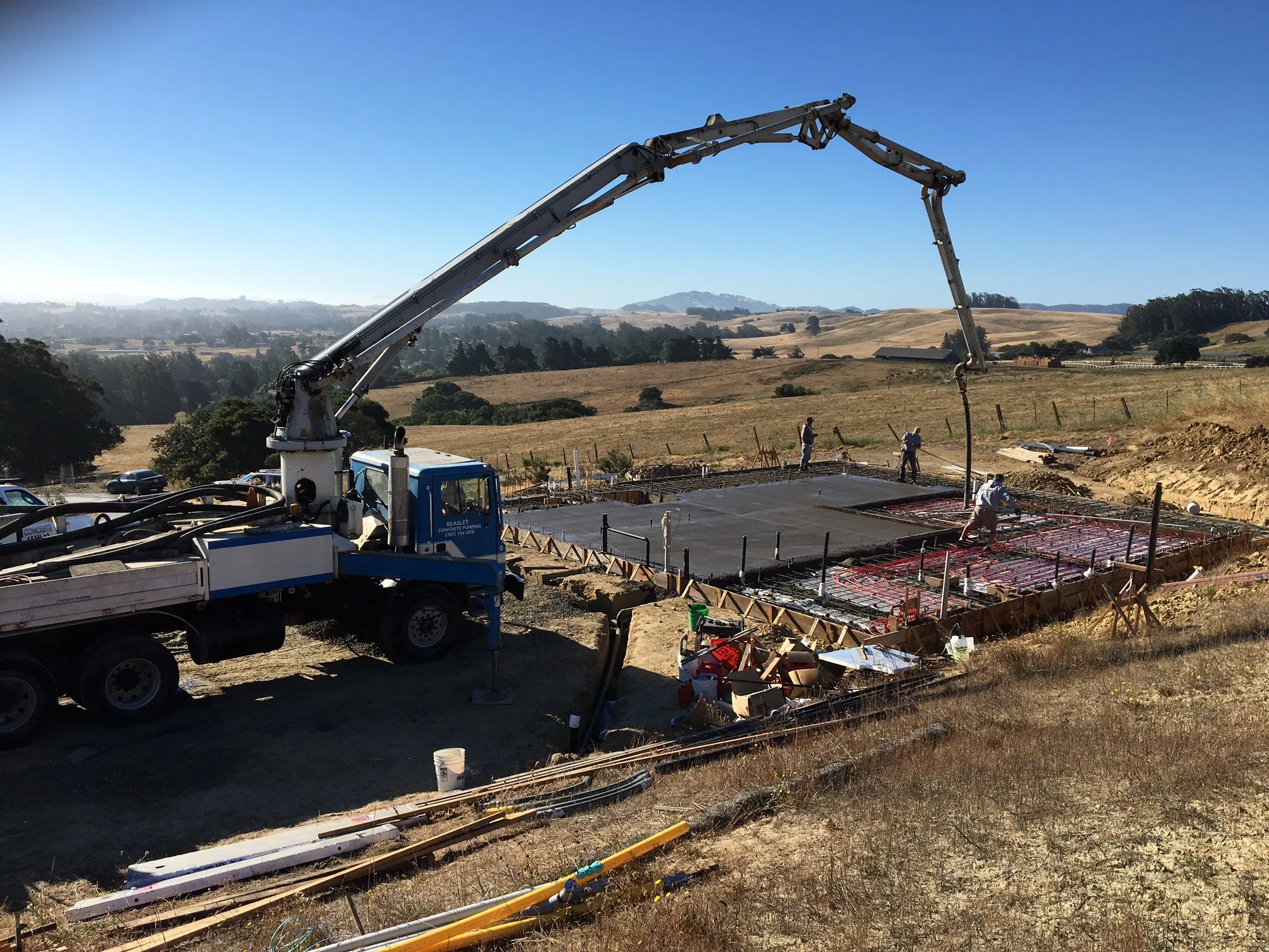 Picture of Evenich Construction, Inc. orchestrates a seamless concrete pour on a tranquil hillside, illustrating their commitment to quality outcomes. This project exemplifies their customer satisfaction and expertise. Copyright ©2025 Diamond Certified Resource. - Evenich Construction, Inc.