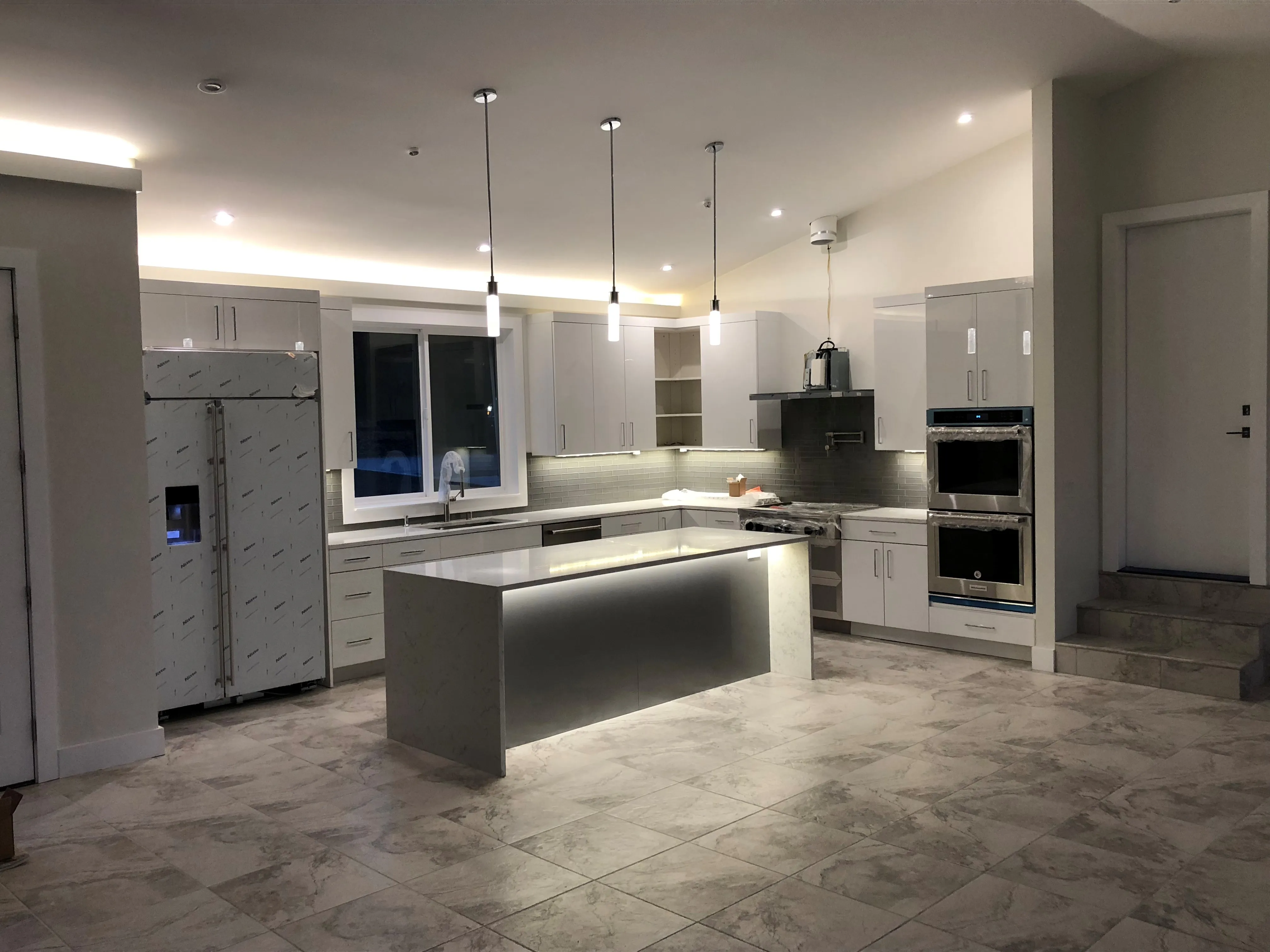 Picture of In a beautifully illuminated kitchen, Evenich Construction, Inc. showcases its commitment to quality outcomes with sleek cabinetry and modern design elements. This refined space hints at the company’s dedication to customer satisfaction and innovative solutions. Copyright ©2025 Diamond Certified Resource. - Evenich Construction, Inc.