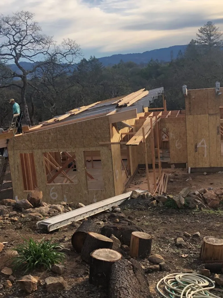 Picture of Amidst a serene landscape, Evenich Construction, Inc. meticulously assembles a home, embodying their focus on quality outcomes. The precision in framing hints at their dedication to excellence. Copyright ©2025 Diamond Certified Resource. - Evenich Construction, Inc.