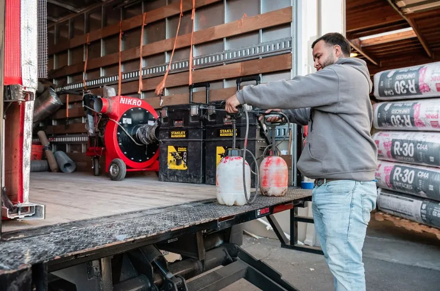 Picture of A worker at Alley Cat carefully adjusts equipment on a well-organized truck, illustrating the company's commitment to quality outcomes. Recognized for expertise and quality, Alley Cat ensures their tools are ready for the job ahead. Copyright ©2025 Diamond Certified Resource

 - Alley Cat