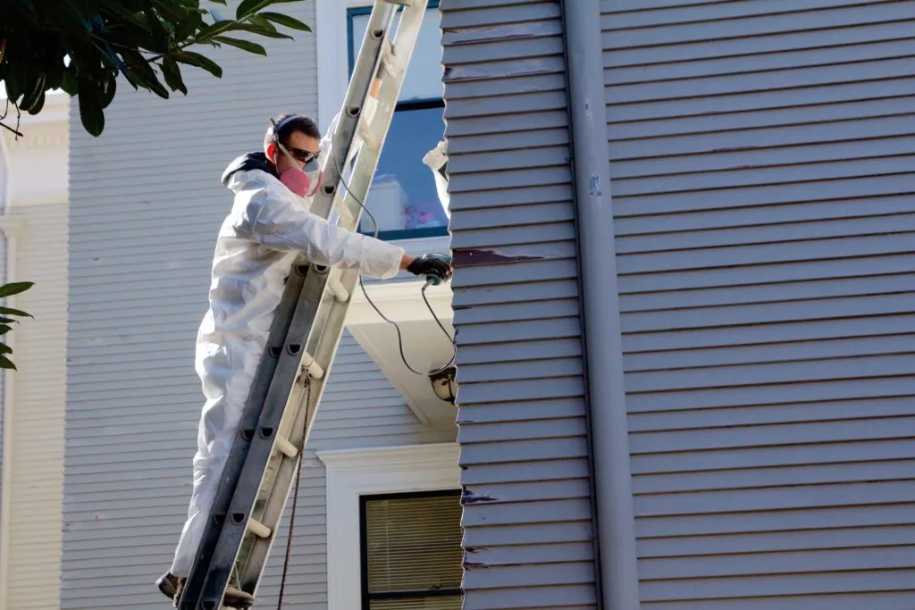 Picture of  A skilled professional from Stanford Painting, Inc. works meticulously on a residential exterior, embodying the company's focus on quality outcomes. The serene dedication to craft is reflected in their top-rated service for quality. Copyright ©2025 Diamond Certified Resource.

 - Stanford Painting, Inc.