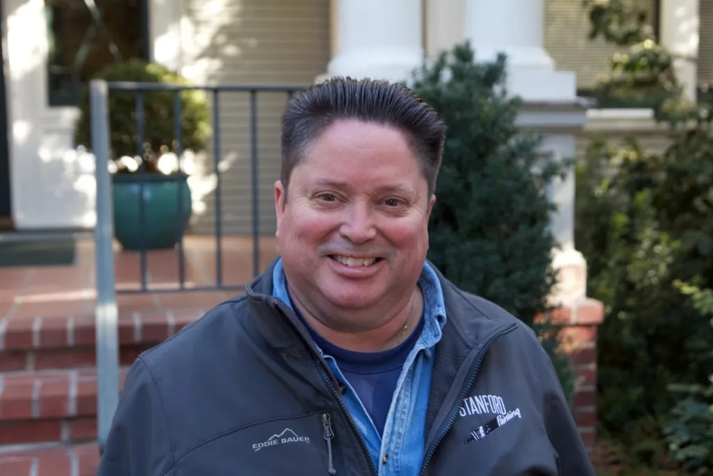 Picture of  A welcoming smile in front of expertly maintained exteriors hints at Stanford Painting, Inc.'s commitment to quality outcomes. With high customer satisfaction ratings, the company embodies reliability. Copyright ©2025 Diamond Certified Resource.

 - Stanford Painting, Inc.