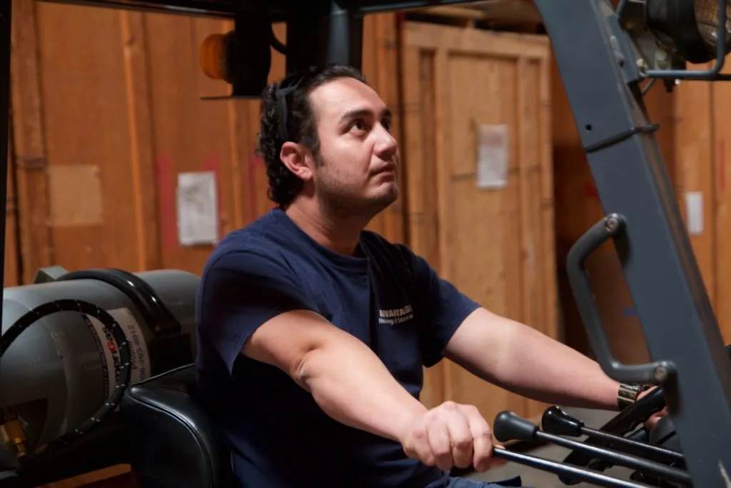 Picture of  In a focused moment of precision, a worker at Advantage Moving & Storage operates a forklift, embodying the company’s recognized expertise and quality in handling delicate operations. Advantage Moving & Storage consistently achieves a Highest in Quality rating. Copyright ©2025 Diamond Certified Resource.

 - Advantage Moving & Storage